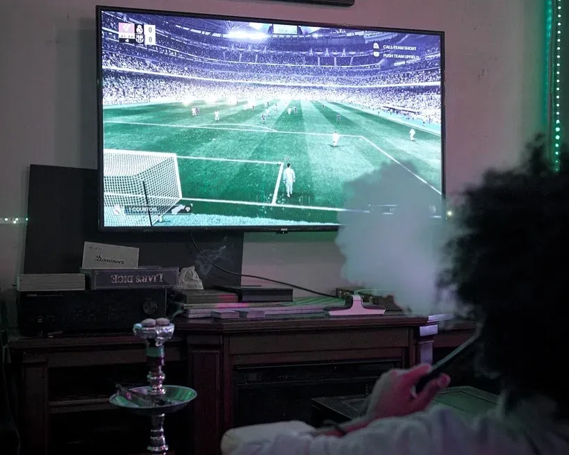 FIFA on the big screen at Dose Shisha, with a hookah alight in the foreground